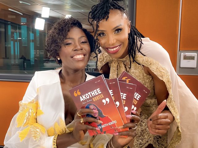 Olivia Otieno and a guest holding copies of a book of quotes in a radio studio
