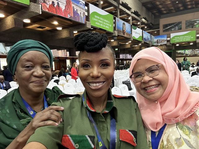 Olivia Otieno taking a selfie with two delegates at the Africa Climate Summit